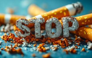Stop smoking campaign visual message. Stylized letters spelling stop are surrounded by crushed cigarettes and tobacco, promoting a smoking cessation message. photo