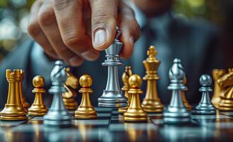 Strategy in intense chess game. A hand moves a silver king piece on a chessboard, highlighting a critical moment in a competitive game outdoors. photo