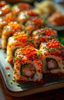 Sushi rolls on a platter. Vibrant sushi rolls topped with colorful fish roe are elegantly arranged on a platter. photo