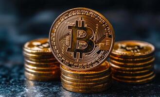 Bitcoin coins stacked on a dark surface. Golden Bitcoin coins stacked neatly on a textured dark surface, showcasing their intricate design and shiny appearance. photo