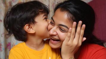 Mother and son share a joyful moment indoors full of laughter and affection during a cozy evening photo
