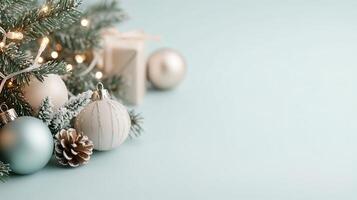 Christmas light decoration with branches pine cones and fir tree blue on winter frosted background with copy space photo