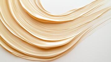 An abstract 3d paint stroke in a tones on gold white background. The close up view highlights the texture photo