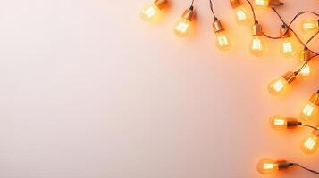 Vintage christmas illuminated light bulbs glowing against hanging warm pastel gradient background, creating softly, festive ambiance photo