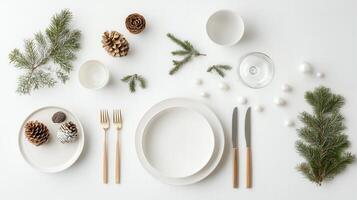 Refined holiday dining ornaments with pristine setup gleaming silverware, crystal glassware, adorned with frosted evergreen branches and delicate white porcelain, photo