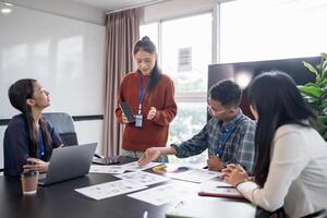Asian business woman Application Designers presenting trending products report mobile application planning process development software design project ux photo