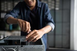 a man is fixing a computer case photo