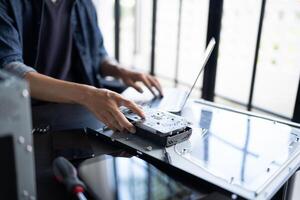 a person is using a laptop and a computer photo