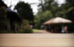 Empty wood table and blur of restaurant background selective focus product display photo