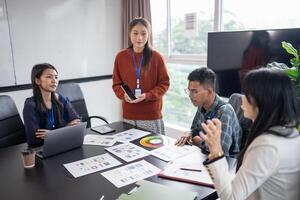 Asian businesswoman Application Designers presenting trending products mobile application planning process development software design project ux Graphic designer photo