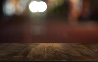 empty wooden table top blurred background photo