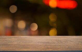 empty wooden table top with blurred background photo