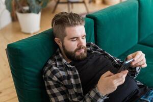 Man surfing on social networking site using smartphone. Technologies and internet concept. photo