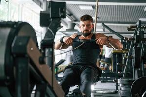 Exercise, for, stamina. Strong muscular man is working out in the gym photo