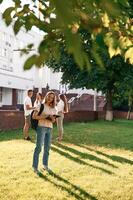 Bonding,, positive emotions. Group, of, students are outside together photo