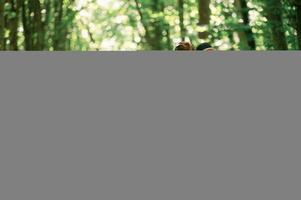 Discovering new place. Kids ,in ,forest at summer daytime together photo