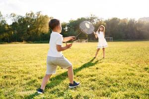 Happy, kids, are on the summer field photo