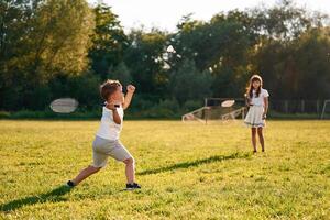 Happy kids, are on the summer field photo