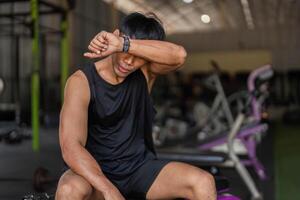 Post-Workout Reflection. Young Man in Gym After Kettlebell Session photo