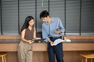 Business Meeting and Analysis. Professionals reviewing reports and discussing strategies in an office. photo