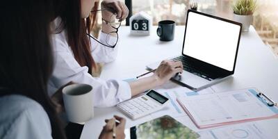 Businessman working on analysis charts and graphs showing results.Her hand holds the pen and points to the graph.Business analysis and strategy. photo