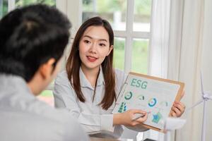 ESG Presentation. Consultant explaining ESG metrics to a client. photo
