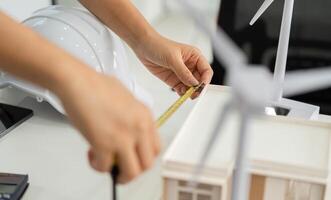 Precision in Architecture. Professional measuring a model for sustainable design. photo