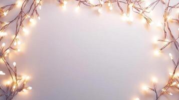Festive string lights framing green eucalyptus branches against crisp white surface, radiating warmth seasonal and elegance photo