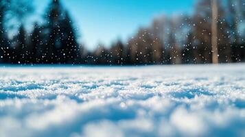 Delicate snowflakes drifting over pristine white landscape, soft evergreen scenery blurring winter silhouettes photo