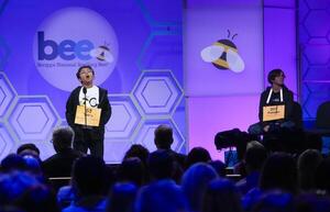 Sarv Dharavane, speller 53, from Tucker, Georgia, left, reacts to incorrectly spelling the word acker in the 18th round as Faizan Zaki, speller 207, from Dallas, Texas, right, waits to spell next for the possible win during the 2025 Scripps National Spelling Bee Finals at the Gaylord National Resort and Convention Center in Oxon Hill, MD, on May 29, 2025. editorial_image