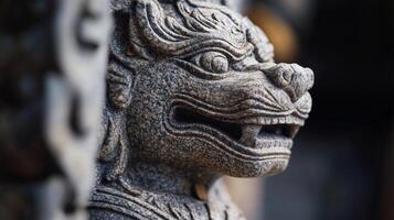 A stone lion statue with a large head photo