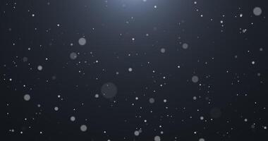 Slowly falling, swirling, and sparkling bokeh particles in white light against a dark background. Abstract snow.2 video