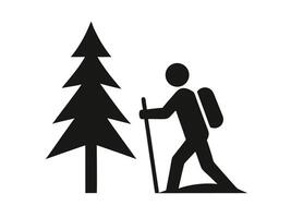 Silhouette of a hiker with backpack and walking stick near a pine tree in nature vector