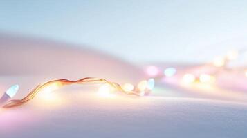 Christmas lights on snow background photo