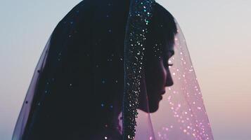A woman wearing a veil and a veil with glitter photo