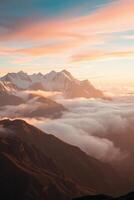 A majestic mountain range at dawn with fog rolling between peaks and golden sunlight illuminating the sky. photo