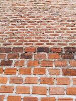 a brick wall with a few bricks on it photo