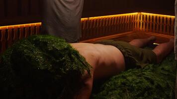 Two Professional Bath Attendants Steaming Body Of Male Person By Oak Brooms, Feel Warm And Fragrant video