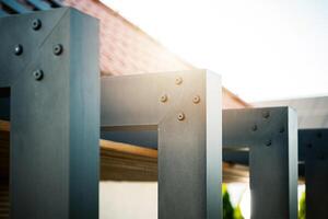 Structural Details of Modern Metal Framework Illuminated by Sunlight in an Outdoor Setting photo