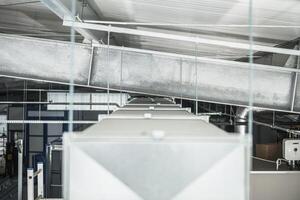 Metal Ductwork and Machinery Create a Functional Atmosphere in an Industrial Space photo