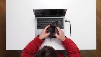 A person is using a laptop with a cloth video