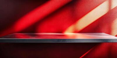 Shelf with a red background and a silver surface photo