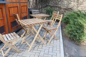 Enjoying Outdoor Wooden Furniture in a Cozy and Inviting Setting for Relaxation and Leisure photo