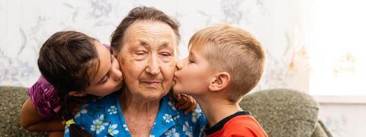 Love, Feelings, and Emotions About the Elderly. In The Center Is The Grandmother Laughing As She Receives The Love Of Her Family photo