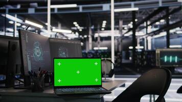 Mockup laptop and computer in data center used in artificial intelligence model deployment. Isolated screen devices in server farm set up to simulate AI environment diagnostics video