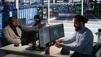 Engineer in data center reorganizing desk items at workstation to streamline workflow and boost productivity. Technician arranging desk objects to optimize efficiency during tasks, camera A video