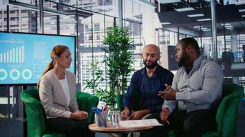 Business meeting in corporate office involving executive decision making, strategic thinking and planning. Diverse professionals ensure organizational growth and performance metrics. Camera A. video