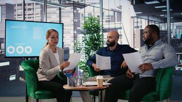 Woman business leader interrupting a meeting for an insightful phone call, discussing some important details on the telephone line. Diverse ambitious CEOs during a conference. Camera A. video