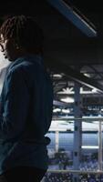Vertical Data center engineer walking on industrial platform, running diagnostics on equipment to identify errors. Server farm IT professionals preventing rigs failure to minimize downtime, camera A video