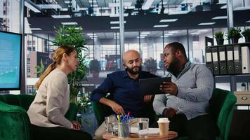 Office meeting featuring diverse professionals engaged in company planning and negotiation, using research and leadership skills to support career development and partnership opportunity. Camera A. video